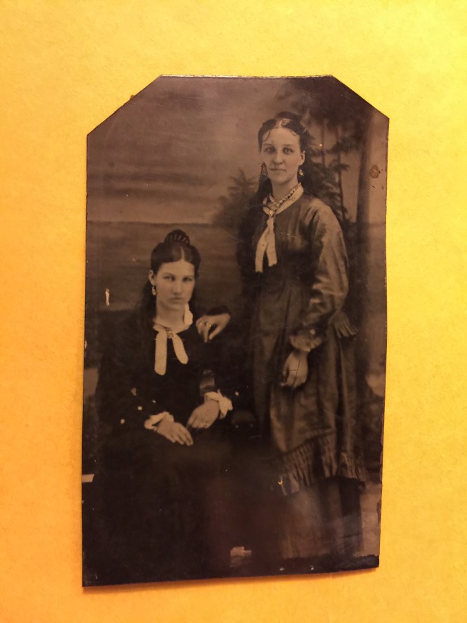 2-women_1-sitting-1-standing