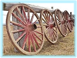 wagon wheels on fence.soft blue edge.jpg
